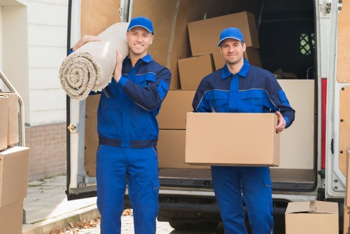 Man and van team loading boxes for a local move in Finsbury Park