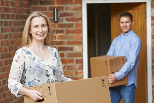 Careful loading of boxes and household items into a truck in North London