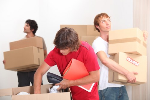 Removal job with furniture and boxes in a busy North London street