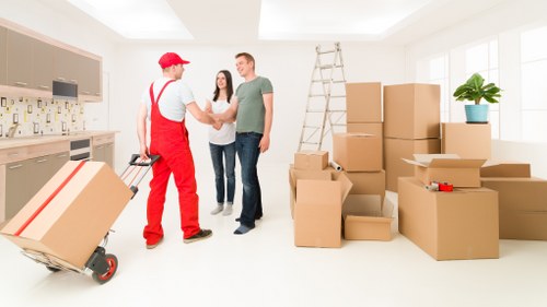 Careful loading of household items into a removals van