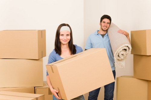 Packed office boxes and furniture prepared for commercial relocation