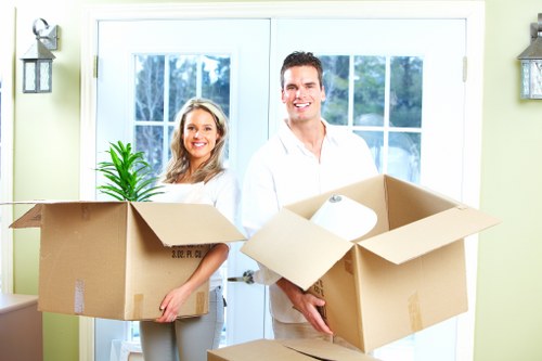 Packed moving boxes ready for transport in a North London flat