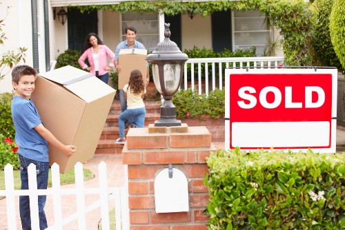 Careful unloading of boxes and furniture at a new Finsbury Park home